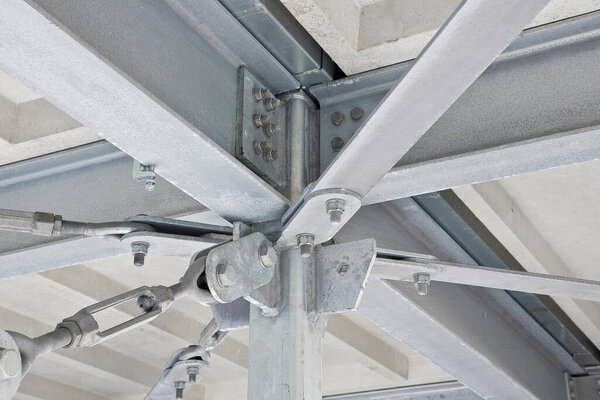Detail of a new customizes prefabricated metal carpentry with galvanized steel components and welded and bolted steel flanges - column beam junction