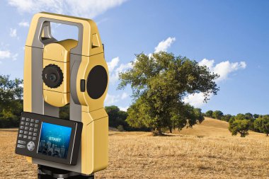 Isolated oak tree in a golden wheat field and 3D rendering of a geodesic device, called Total Station used for the survey of topographic maps and topographical survey.  clipart