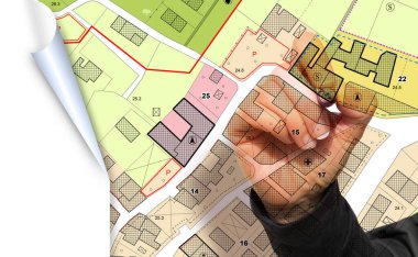 Imaginary General Urban Plan with indications of urban destinations with buildings, roads, buildable areas and land plot with female hand writing