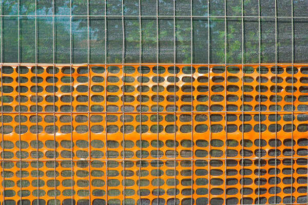 PLASTIC SAFETY GRID in construction site areas to delimit and protect construction activities