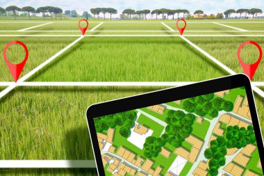 Boş arazi ve kadastro parseli ile emlak kavramı dijital tablet ve hayali kadastro haritası ve şehir planlaması ile inşaat için kullanılabilir.