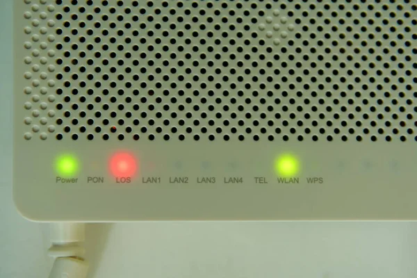 macro shot of Internet router with red light indicator. LOS indicator turning red. That mean the internet is not working. Wifi modem