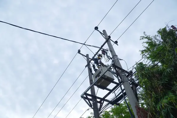 Powerline above ground. Power transmission. Insulation and switches - Components of the transformer. high voltage pole high voltage transmission tower high voltage power distribution