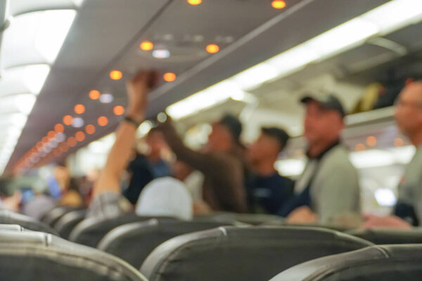 Blurred background of interior aircraft , luggage cabin. the atmosphere in the aircraft cabin before the flight
