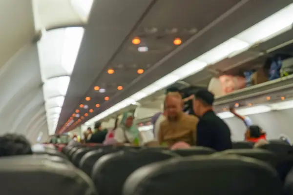 Blurred background of interior aircraft , luggage cabin. the atmosphere in the aircraft cabin before the flight