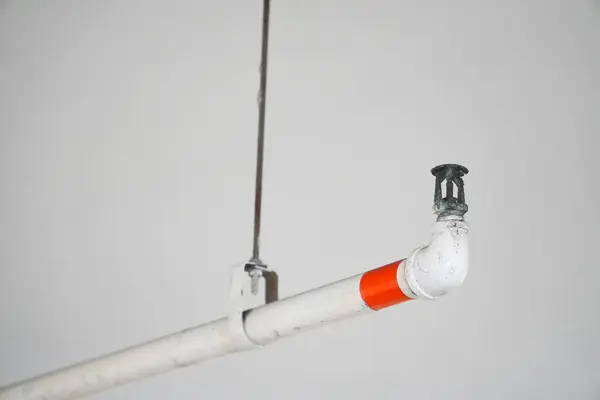 Drencher firefighting system. Automatic fire extinguishing system. Atomizer for automatic flame extinguishing. Fire extinguishing agent supply system under roof. Drencher system fragment close-up