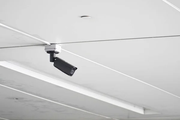 CCTV security camera install inside building for safety monitoring and video record. Digital security camera technology concept of surveillance monitoring for safety. copy space