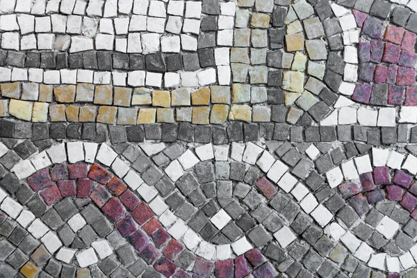 Close up of tiles of Lod Mosaic, famous Roman mosaic floor in Lod town in Israel, displayed in Shelby White and Leon Levy Lod Mosaic Center. Mosaic depicts land animals, fish and two Roman ships.