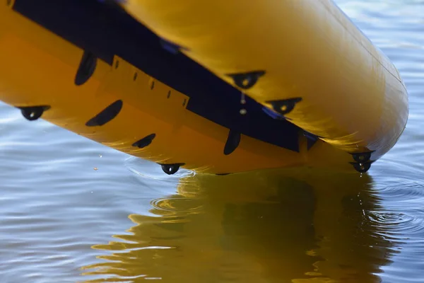 yellow inflatable kayak on the river closeup