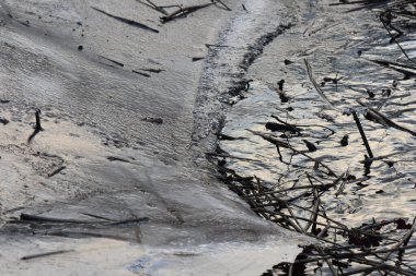 The texture of cracked ice on the river in the early spring after low tide clipart