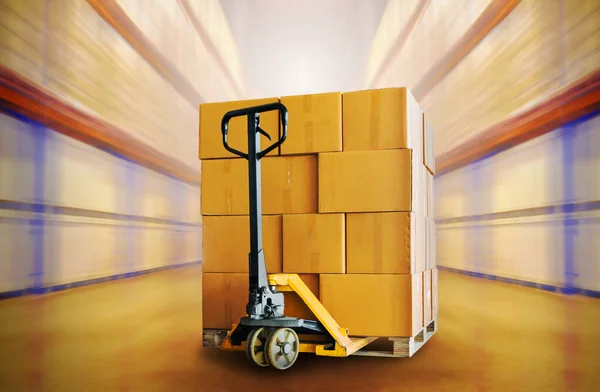 Packaging Boxes Stacked on Pallet with Hand Pallet Truck. Cartons, Cardboard Boxes. Storage Warehouse. Shipment Goods. Cargo Shipping Supplies Warehouse Logistics.
