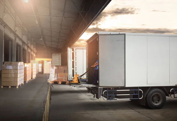 stock image Warehouse Workers Unloading Cargo Boxes on Pallet into Container Trucks. Distribution Shipping Warehouse. Delivery Trucks. Shipment Goods. Supply Chain. Supplies Warehouse Logistics Transport.