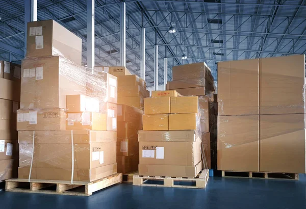 Packaging Boxes Stacked on Pallets in Storage Warehouse. Supply Chain. Storehouse Distribution. Cargo Shipping Supplies Warehouse Logistics.