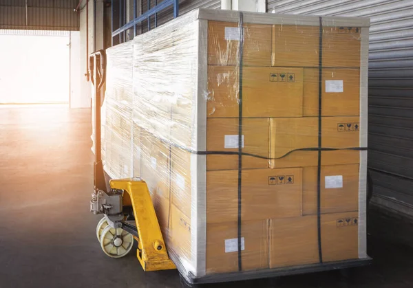 Packaging Boxes Stacked on Pallets in Storage Warehouse. Supply Chain. Storehouse Distribution. Cargo Shipping Supplies Warehouse Logistics.