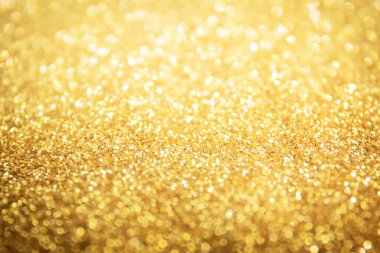 Soyut Güzel Bokeh Parıltısı Altın Arkaplan 'ı aydınlatıyor. Odaklanmamış Efekt Duvar Kağıdı, Kutlama Noel Arkaplanı.