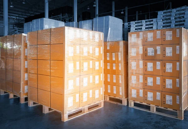 Packaging Boxes Wrapped Plastic Stacked on Pallets. Storage Warehouse. Cartons, Cardboard Boxes. Supply Chain. Storehouse Distribution. Cargo Shipping Warehouse Logistics.