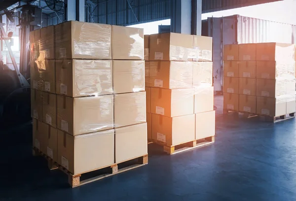 Packaging Boxes Wrapped Plastic Stacked on Pallets in Storage Warehouse. Supply Chain. Storehouse Distribution. Cargo Shipping Supplies Warehouse Logistics.