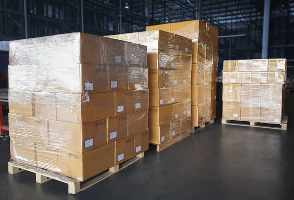 Packaging Boxes Wrapped Plastic Stacked on Pallets. Storage Warehouse. Cartons, Cardboard Boxes. Supply Chain. Storehouse Distribution. Cargo Shipping Warehouse Logistics.