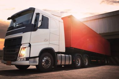 Tractor Trucks Engine Diesel. Semi Trailer Trucks Parked Loading at Dock Warehouse. Shipping Cargo Container Delivery. Distribution Warehouse. Freight Trucks Logistics Cargo Transport