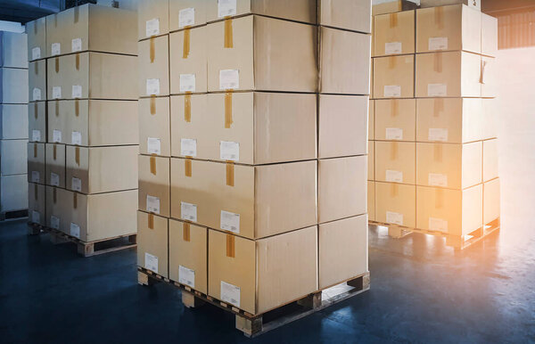 Packaging Boxes Stacked on Pallets in Storage Warehouse. Supply Chain. Storehouse Distribution. Cargo Shipping Supplies Warehouse Logistics.