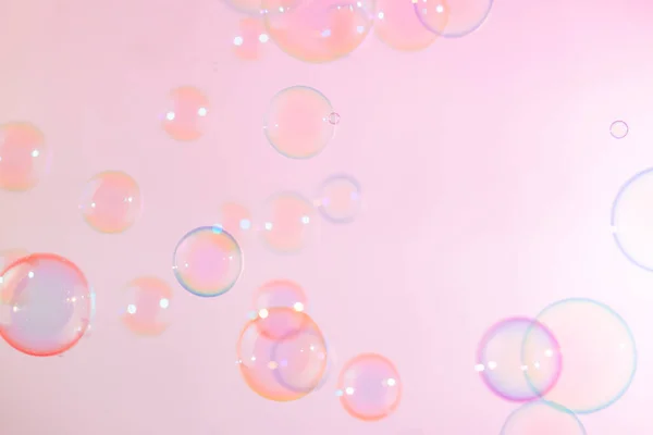 Beautiful Transparent Pink Soap Bubbles Abstract Background. Defocus, Blurred Celebration, Romantic Love ValentinesTheme. Circles Bubbles. Freshness Soap Sud Bubbles Water