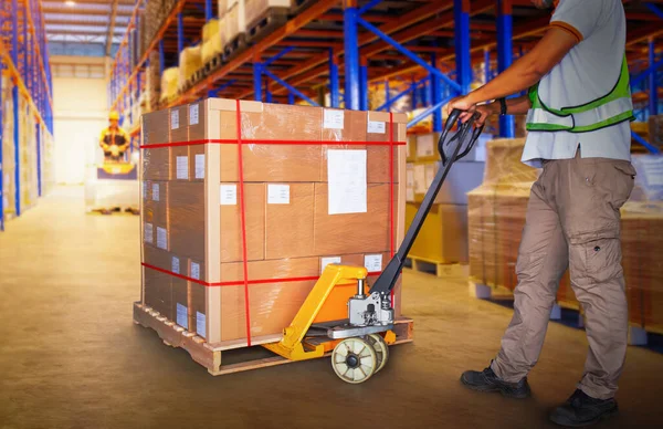 Workers Unloading Package Boxes on Pallets in Warehouse. Cartons Package Boxes. Pallet Jack Loader. Deliver Parcels to Customers. Supply Chain Shipment Goods. Distribution Supplies Warehouse Logistics