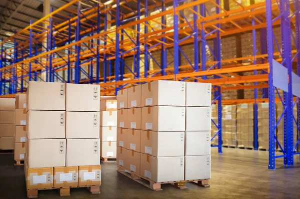 Package Boxes Stacked on Pallets in Storage Warehouse. Cartons, Cardboard Boxes. Storehouse Distribution Storage Tall Shelf. Supply Chain. Shipping Cargo Supplies Warehouse Logistics