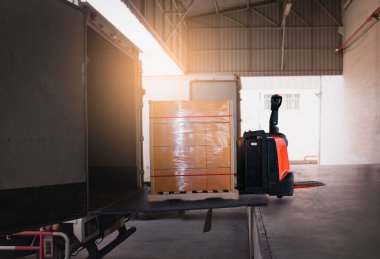 Package Boxes Wrapped Plastic Stacked on Pallets Loading into Cargo Container. Loading Dock Distribution Supplies Warehouse. Shipping Supply Chain Shipment. Freight Truck Logistics Cargo Transport