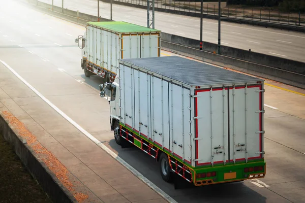 Cargo Trucks Driving on Highway Road. Shipping Container Commercial Truck Transport. Delivery. Diesel Trucks, Lorry, Freight Trucks Logistics Cargo Transport