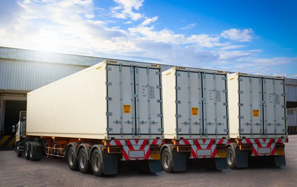 Semi Trailer Trucks on The Parking Lot at Warehouse. Loading Dock Warehouse. Shipping Cargo Container. Delivery Express, Distribution Freight Trucks Cargo Transport, Warehouse Logistics.