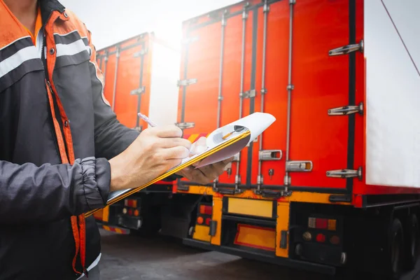 Truck Drivers Hold a Clipboard The Checking Container Door. Security of Cargo Shipping. Load Trucks. Inspection Safety Checks Before Driving. Shipment, Delivery Freight Truck Logistic Transport.