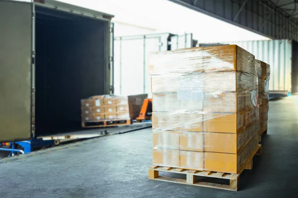 Package Boxes Wrapped Plastic Stacked on Pallets. Loading Truck at Warehouse Dock, Cargo Container, Distribution Supplies Shipping, Supply Chain, Shipment. Freight Truck Logistic Cargo Transport.