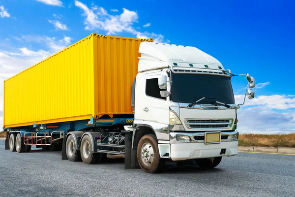 Semi Trailer Truck Driving on The Road with Blue Sky. Shipping Cargo Container, Commercial Truck Transport. Delivery Express. Diesel Trucks. Lorry Tractor. Freight Truck Logistic.
