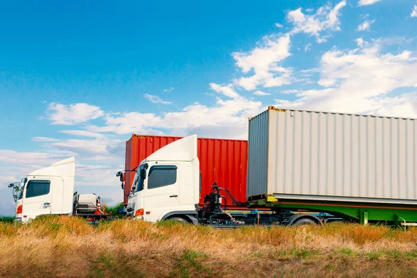 Semi Trailer Trucks Driving on The Road with A Blue Sky. Shipping Cargo Container, Commercial Truck Transport. Delivery Express. Diesel Trucks. Lorry Tractor. Freight Truck Logistic.