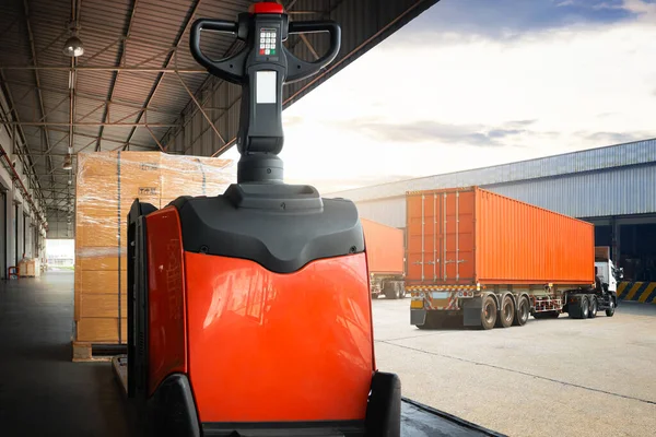 Electric Forklift Pallet Jack with Package Boxes in Warehouse. Semi Trailer Trucks Loading at Dock Warehouse. Cargo Container Shipping, Distribution Warehouse Supplies Shipment. Freight Truck Logistic