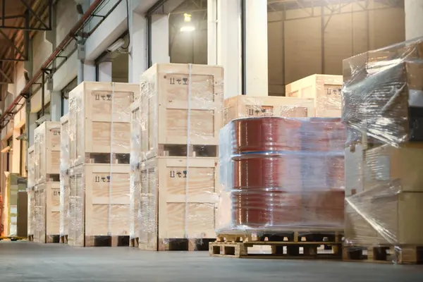 Wooden Crates and Barrel Tank Wrapped Plastic Stacked on Pallets in Warehouse. Heavy Goods Shipment, Package Boxes, Supply Chain. Storehouse Distribution. Cargo Supplies Warehouse Shipping Logistics
