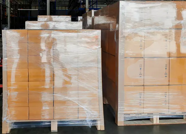Package Boxes Wrapped Plastic Stacked on Pallets. Storage Warehouse, Storehouse Distribution. Supply Chain. Shipping Cargo Supplies Warehouse Logistics.