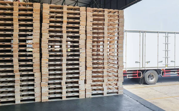 Wooden Pallets Stacked in Warehouse. Industry Cargo Transport Logistics