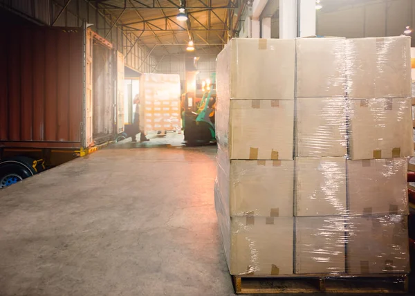 Package Boxes Wrapped Plastic Stacked on Pallets. Trailer Trucks Loading at Dock Warehouse. Cargo Container, Distribution Supplies Shipping. Shipment Goods. Freight Truck Logistic Transport.