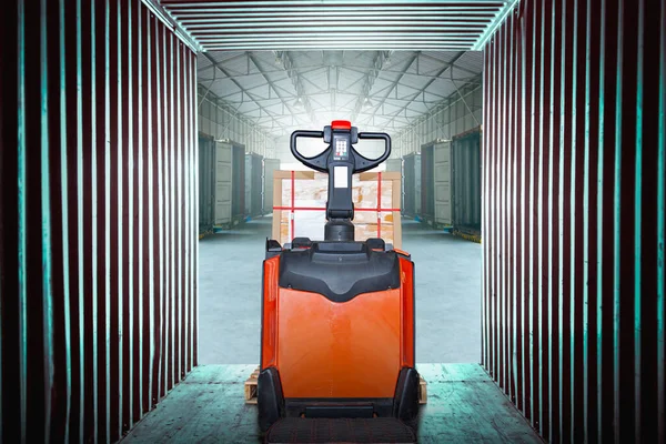 Electric Forklift Pallet Jack with Package Boxes in Cargo Container. Forklift Loader. Warehouse Shipping. Supply Chain, Shipment, Freight Truck Logistic, Cargo Transport.