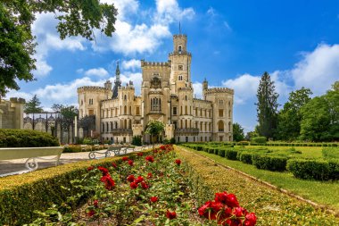 Summer view of famous Czech castle Hluboka nad Vltavou, medieval building with beautiful park, European exterior background.