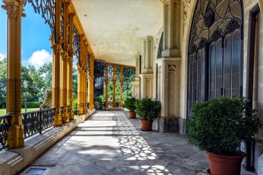 Summer terrace of famous Czech castle Hluboka nad Vltavou, medieval building with beautiful park