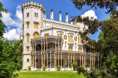 Summer view of famous Czech castle Hluboka nad Vltavou, medieval building with beautiful park, European exterior background.