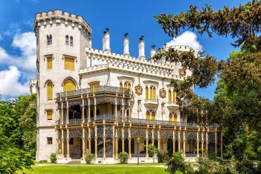 Summer view of famous Czech castle Hluboka nad Vltavou, medieval building with beautiful park, European exterior background.