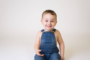 Happy child - isolated over a white background.