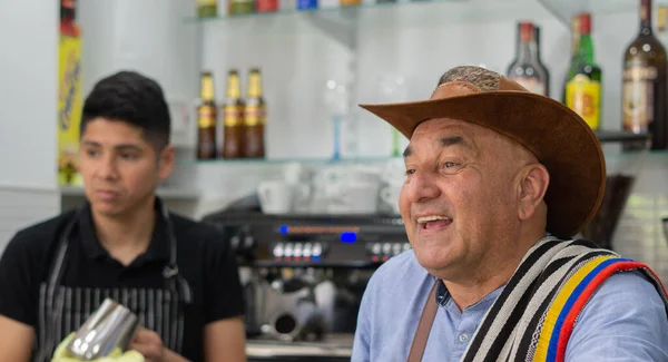 happy colombian worker in cafeteria