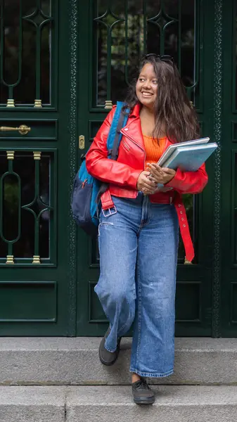 stock image young student walking down the stairs leaving home