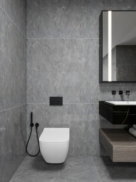 Minimalist tasarımı olan modern banyo, mat siyah armatürler, gri mermer fayanslar, siyah lavabolu yüzen kibir ve entegre ışıklandırmalı büyük bir ayna. Zarif ve nötr stil