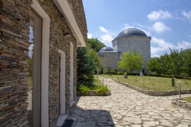 Ak Yazili Sultan Baba Dervish, tekke, view from garden the 16 century tomb of the muslim religious leader in Obrochishte, Bulgaria clipart