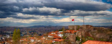 Ankara Castle, ancient fortifications in the capital city of Turkey. Ankara Castle, symbol of Ankara. Capital of Trkiye. Ankara citadel. Old historic houses cloudy blue sky. Best popular touristic. clipart